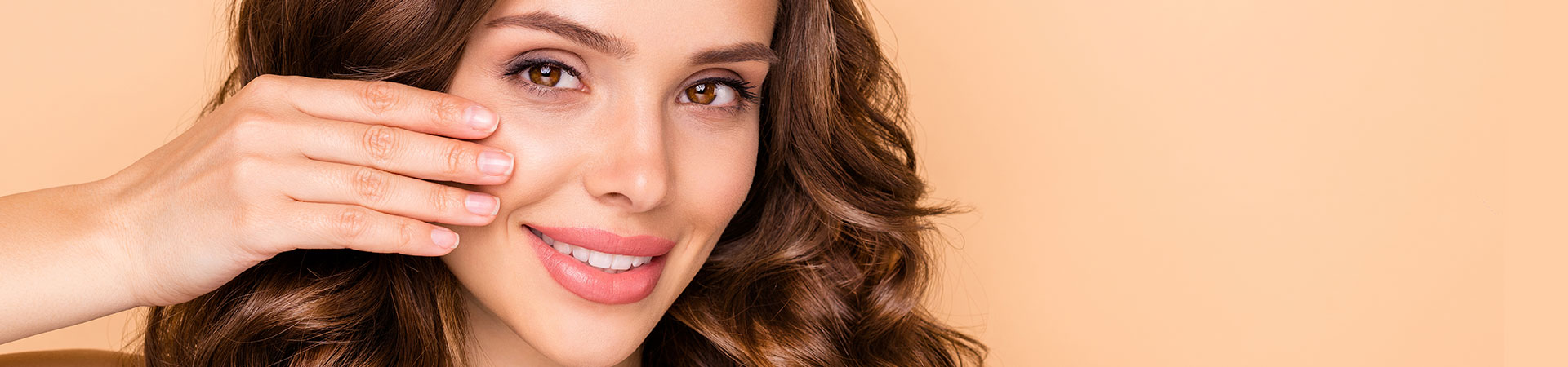 Dermatologist touching face of beautiful mature woman